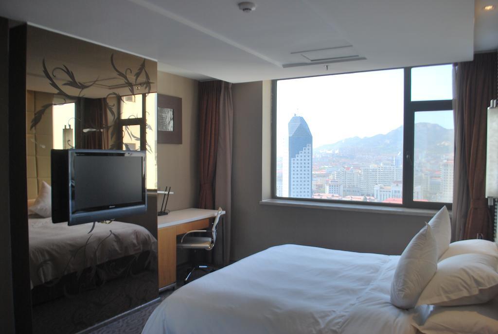 The Center Hotel Weihai Habitación foto