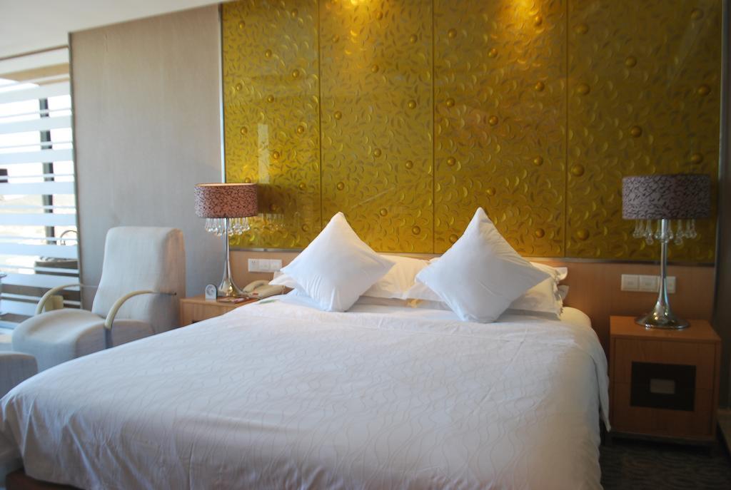 The Center Hotel Weihai Habitación foto